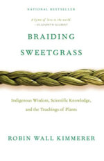 Image depicts the book cover of Braiding Sweetgrass by Robin Wall Kimmerer. A braid of grass runs horizontally across a white cover.